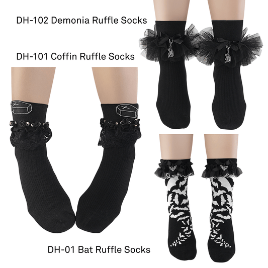 Black ruffle socks with decorative elements on a white background
